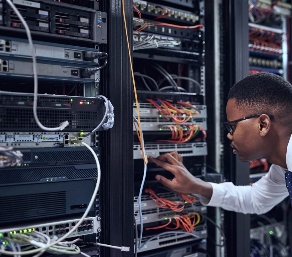 Cropped shot of a IT technician working and checking if all the servers are up and running