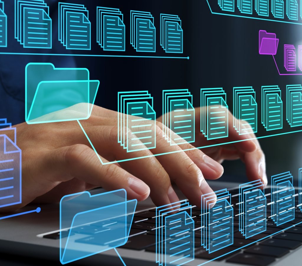 Businessman using laptop computer to control document versions.