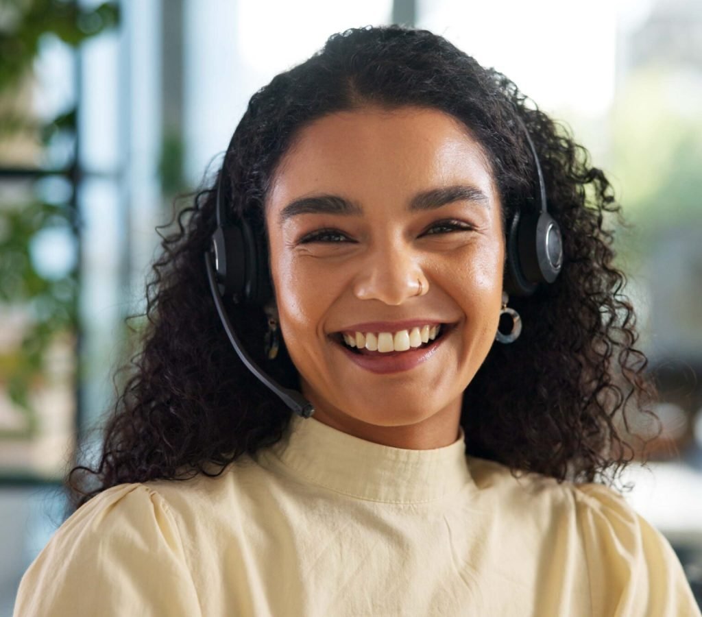 Agent, happy woman and customer service in portrait with smile, communication and online consulting. Sales, confident consultant and call center office for CRM contact support, advice or business